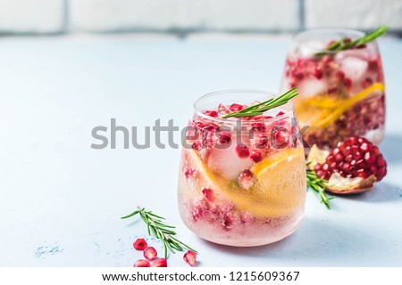Festive drinks, citrus, pomegranate cocktail. Selective focus, space for text. 
