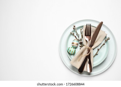 Festive Easter Table Setting With Floral Decor On White Background, Top View