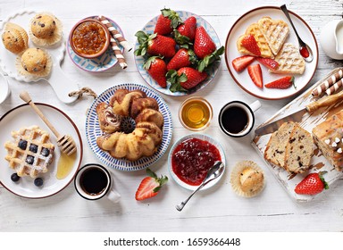 Festive Family Dessert Table With  Pancakes, Waffles, Sweets And Fresh Strawberry. Overhead View