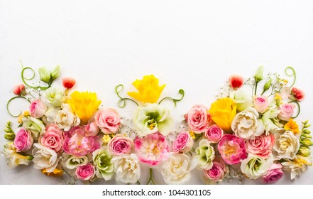 Festive flower composition on the white  background with copy space. Overhead view.