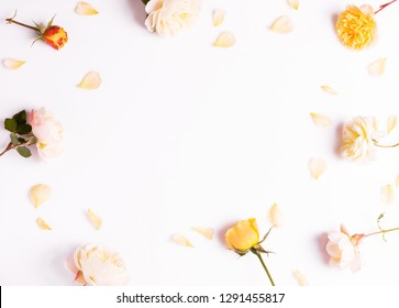 Festive flower yellow pink English rose composition on the white background. Overhead top view, flat lay. Copy space. Birthday, Mother's, Valentines, Women's, Wedding Day concept.
