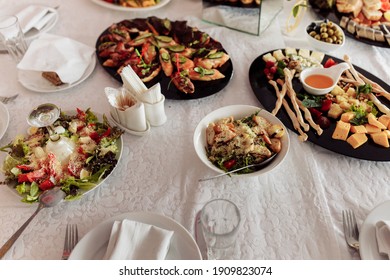 Festive Food Lies On The Wedding Table. Buffet For Guests. A Lavish Banquet. Wedding Buffet. Different Cheeses. Table For Guests. Wedding Treat