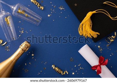 Festive graduation image featuring a cap, diploma, champagne bottle, and confetti on blue