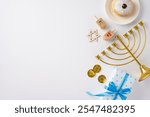 A festive Hanukkah arrangement featuring a menorah, dreidels, Star of David, coins, and a gift box, perfect for celebrating the Jewish holiday