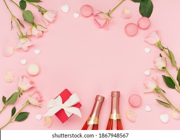 Festive Holiday Greeting Card For Valentines, Birthday, Woman Or Mothers Day. Flowers, Bottle Of Wine, Sweets And Gift On Pink Background. Valentines Day Concept. Flat Lay, Top View, Copy Space.