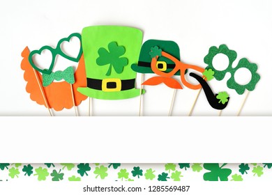 Festive Masks For A St. Patrick's Day On A White Background. Fancy Dress. Party Concept. Flat Lay Objects With Paper Craft On White Wallpaper At Home Office Desk With Copy Space.