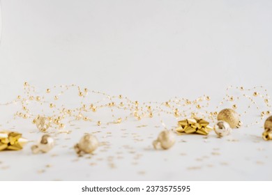 Festive new year or Christmas background with golden decoration and copy space for text or product advertising. Minimal holiday concept. Front view. Copy space - Powered by Shutterstock