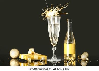 Festive New Year party composition with bottle and glass of alcohol with sparkler on dark background. - Powered by Shutterstock