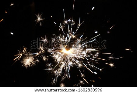 Festive New Year Sparkler. Magic Lights In Darkness. Black And White Background.