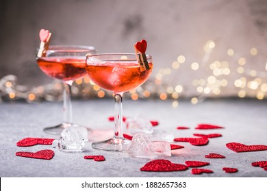 Festive Pink Cocktail With Champagne Or Prosecco  For St. Valentine's Day. Couple Of Glasses