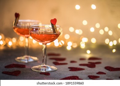 Festive Pink Cocktail With Champagne Or Prosecco  For St. Valentine's Day. Couple Of Glasses