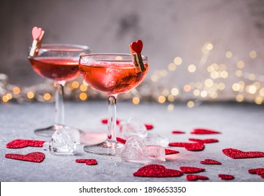 Festive Pink Cocktail With Champagne Or Prosecco  For St. Valentine's Day. Couple Of Glasses