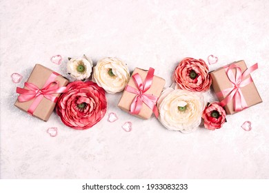 Festive romantic background with peony flowers, gift and hearts on light marble. Top down composition with copy space. Valentine's Day, Mother's Day or 8 March greeting card. - Powered by Shutterstock
