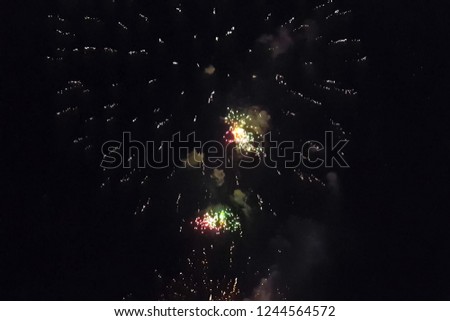 Festive salute in the night sky. Explosions of fireworks.