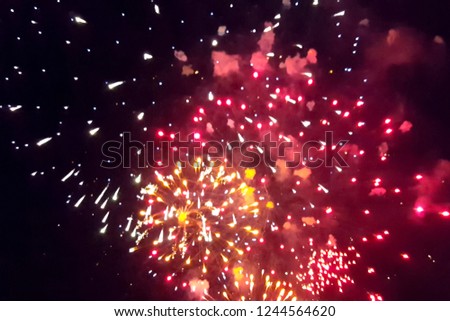 Festive salute in the night sky. Explosions of fireworks.