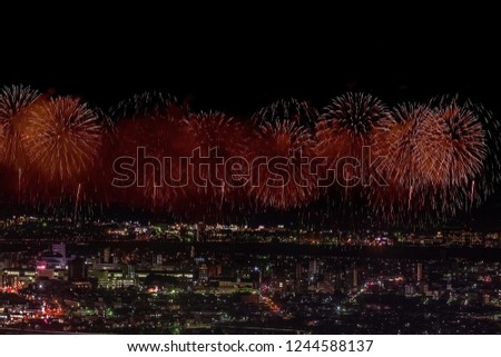 Festive salute in the night sky. Salute over the city the megalopolis. Explosions of fireworks.