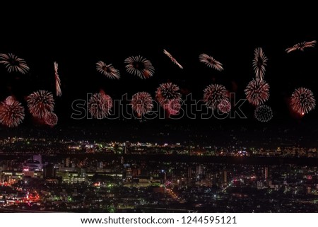Festive salute in the night sky. Salute over the city the megalopolis. Explosions of fireworks.