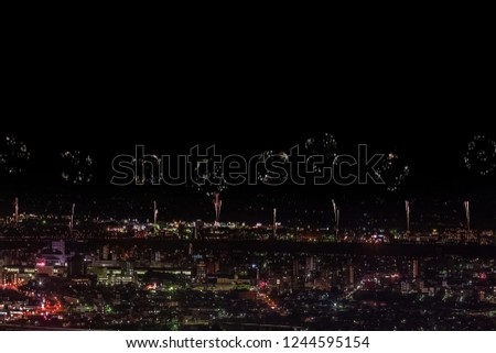 Festive salute in the night sky. Salute over the city the megalopolis. Explosions of fireworks.