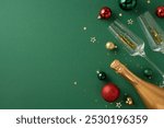 A festive setup featuring a champagne bottle, glasses, and Christmas ornaments on a green background evoking New Year celebration mood