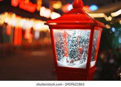 A festive snow globe within a red lantern, set against a backdrop of blurred city lights. This charming scene evokes a sense of winter wonderland amidst the urban environment. - Powered by Shutterstock