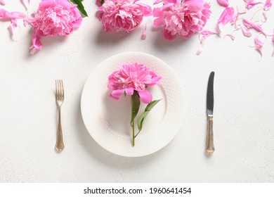 Festive Spring Table Setting With Pink Peony Flowers On A White Table. View From Above. Banquet Invitation.