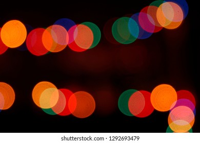 Festive street illumination glittering in darkness. Blurred holiday garland lighting for Chinese New Year. Natural classic bokeh background. Night photo with black copy space for text or logo. - Powered by Shutterstock