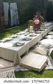 festive table decor dinner outdoor garden party wedding oriental cushions pampas grass palmtrees bohemian boho 