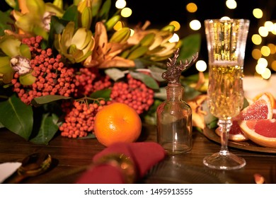 Festive Table With Glasss Of Champange, Flowers And  Fruits