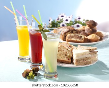 festive table with refreshments and snacks for a veranda party