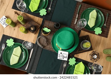 Festive table serving with leprechaun's hat and burning candles, top view. St. Patrick's Day celebration - Powered by Shutterstock