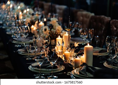 Festive Table Setting With Candles For Wedding Party In The Dark