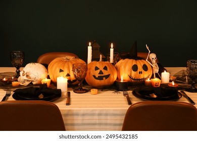 Festive table setting for Halloween celebration with pumpkins and burning candles at evening - Powered by Shutterstock