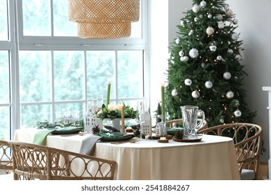 Festive table setting in living room with Christmas tree - Powered by Shutterstock