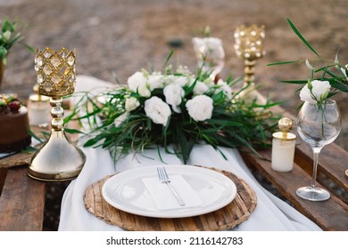 Festive Table Setting. Luxury Decorated Table For A Romantic Date. Festive Details Tablecloth, Candles, Plates, Glasses On Beach Background. Table Decor. Catering For A Romantic Date. Wedding Decor