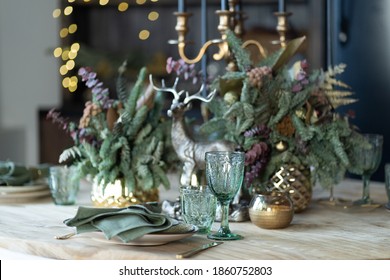 Festive Table Setting For The New Year And Christmas. Beautiful Decorations, Dishes, Candles. Quiet Family Dinner During Self-isolation Due To Covid.