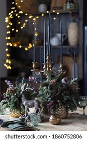 Festive Table Setting For The New Year And Christmas. Beautiful Decorations, Dishes, Candles. Quiet Family Dinner During Self-isolation Due To Covid.