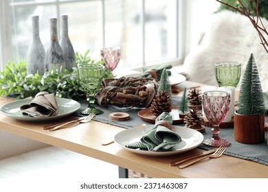 Festive table setting with rustic Christmas decor - Powered by Shutterstock