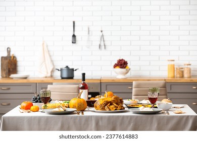 Festive table setting with tasty food for Thanksgiving Day in kitchen - Powered by Shutterstock