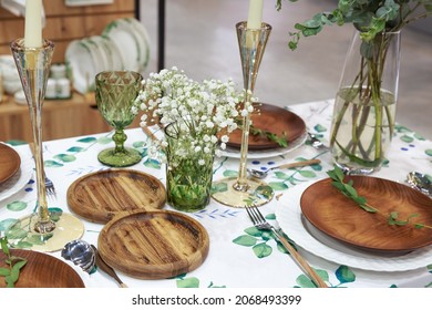 Festive table setting with wooden plates in eco style. Beautiful original reusable bamboo tableware for celebration, eco friendly concept. - Powered by Shutterstock