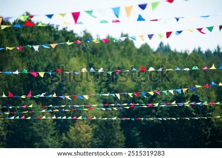 Festive triangular flags and ribbons at a city festival
