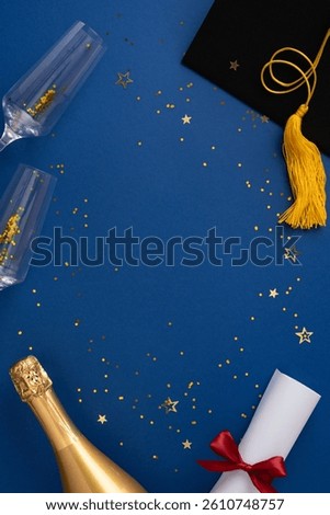 Festive vertical setup featuring a graduation cap, champagne bottle, confetti, and diploma symbolizing celebration and achievements