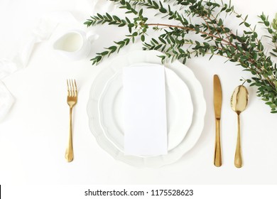 Festive Wedding, Birthday Table Setting With Golden Cutlery, Eucalyptus Parvifolia Branch, Porcelain Plate, Milk And  Silk Ribbon. Blank Card Mockup. Rustic Restaurant Menu Concept. Flat Lay, Top View