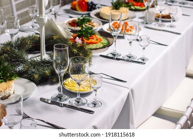 Festive Wedding Table Set For Dinner, Beautiful Expensive Dishes. White Tablecloths And Decorations, Luxury Catering.