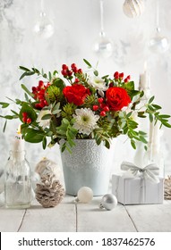 Festive Winter Flower Arrangement With Red Roses, White Chrysanthemum And Berries In Vase On Table Decorated For Holiday. Christmas Or New Year Concept.