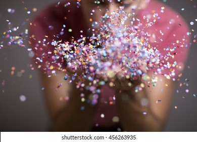 Festive Young Man Throwing Confetti 