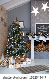 Festively Decorated Living Room With A Fireplace With Christmas Socks. Christmas Room Interior In Scandinavian Style. Christmas Tree With Rustic Decorations, Gifts In Attic Interior. Winter Home Decor