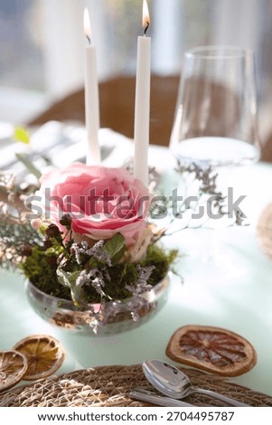 A festively set table for a wedding dinner. Tastefully decorated restaurant background with short depth of field.