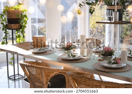 A festively set table for a wedding dinner. Tastefully decorated gastronomy background.