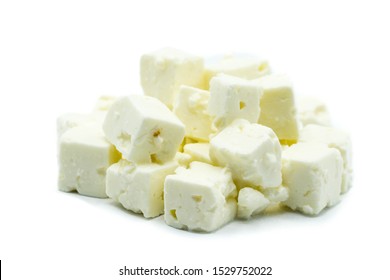 Feta cheese cubes isolated on white background