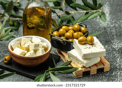 feta cheese with olives and olive oil sauce in bowl on dark background. top view. place for text. - Powered by Shutterstock